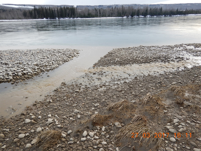 Figure 4: Sediment laden water exiting Unnamed Creek 3 culvert and entering the Peace River
